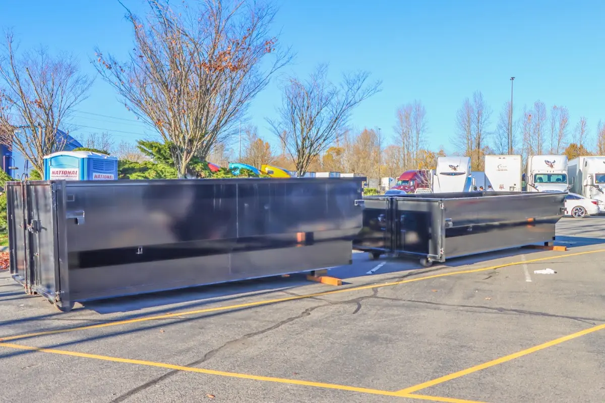 Professional dumpster rental service with roll-off container on residential driveway in Westerville